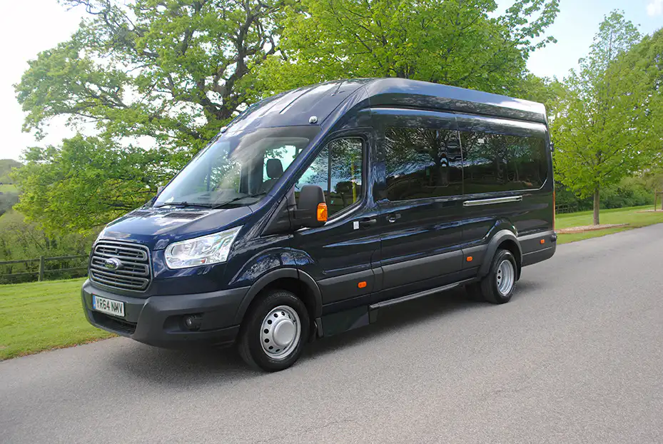 Dark blue Ford Transit Falcon minibus converted by GM Coachwork.